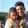 Young couple with their puppy at training class
